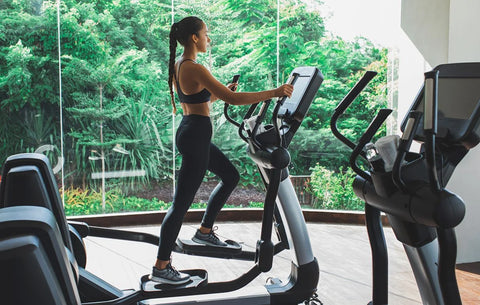 a woman on an elliptical machine