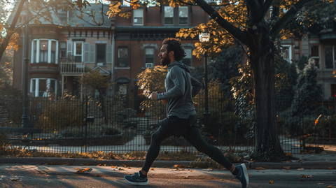 a man running in the morning in a residential area - fasted cardio