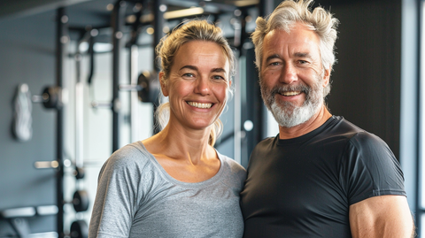 a fit middle-aged couple at the gym